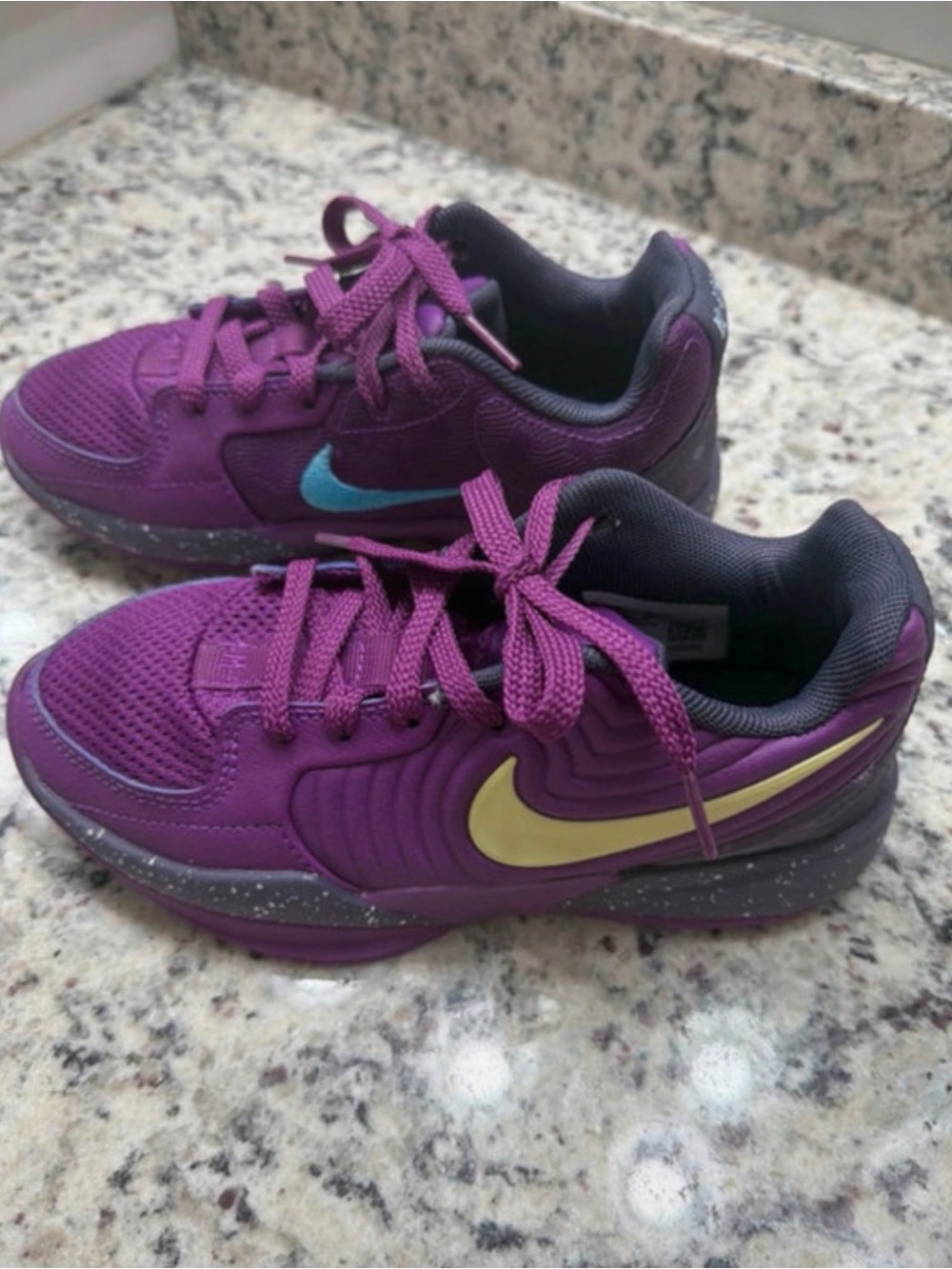 Nike Kids Purple Sneakers with Yellow and Teal Swooshes